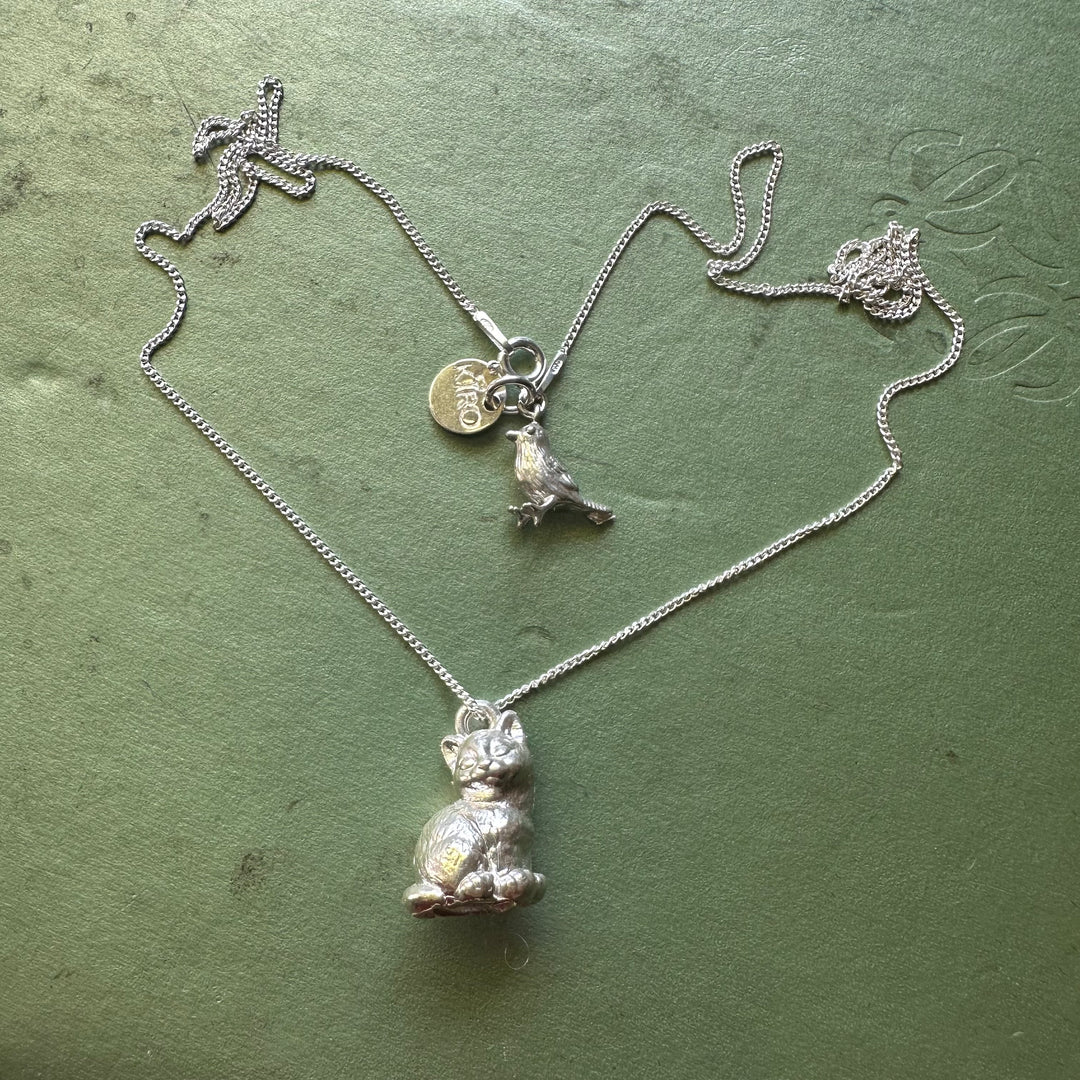 Silver cat bird necklace